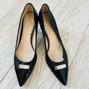 Classic black leather Coach monogram heels; open-toe. Size 9.5 B.